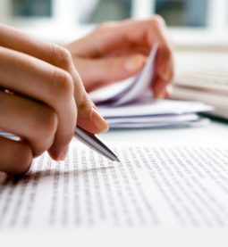 Close-up of secretarys hands doing paperwork
